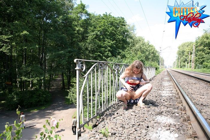 Cute exhibitionist showing pink at a train station #71609706