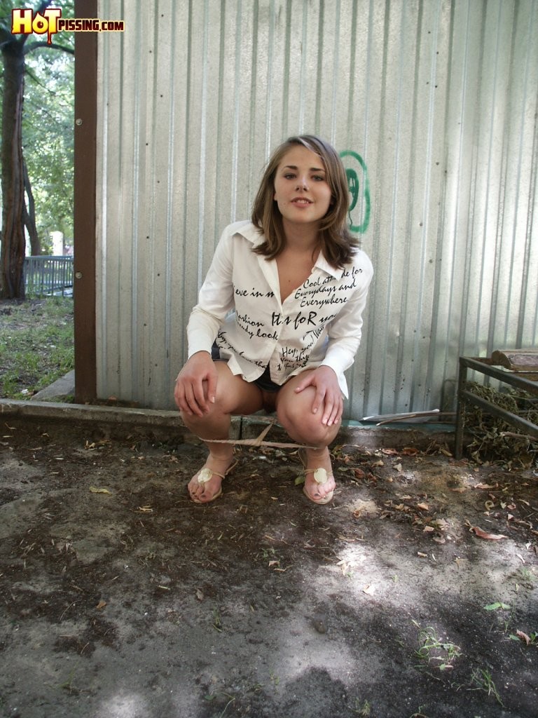 Naughty missy shows off her trimmed twat while peeing behind a garage #76565445