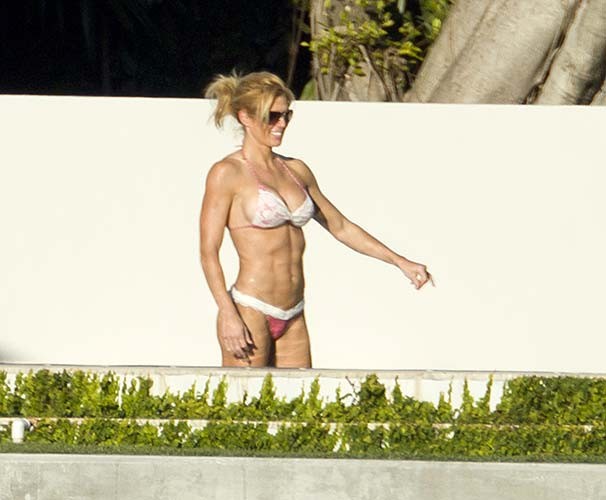 Torrie Wilson exposing sexy body and hot ass in bikini on pool #75276391