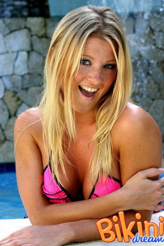 Blonde babe in a thong bikini at the pool #73161328