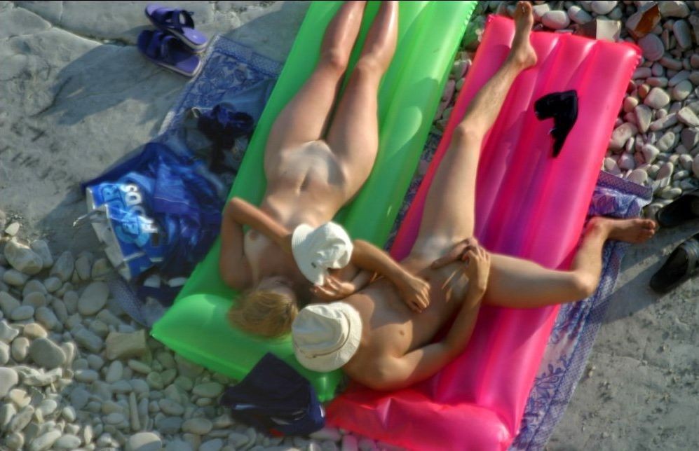 Watch these smooth nudists play at a public beach #72251765