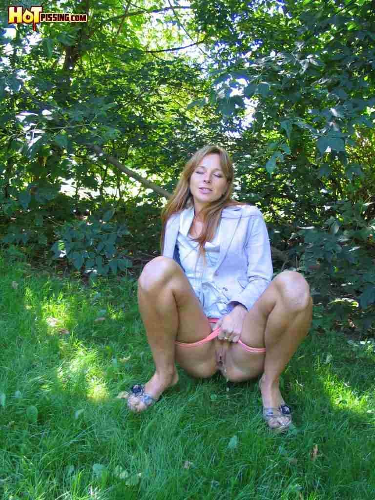 Girl pissing in the woods #76592501
