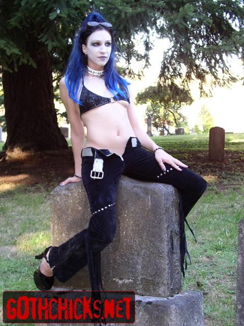 Goth poses on a cemetery #76663377