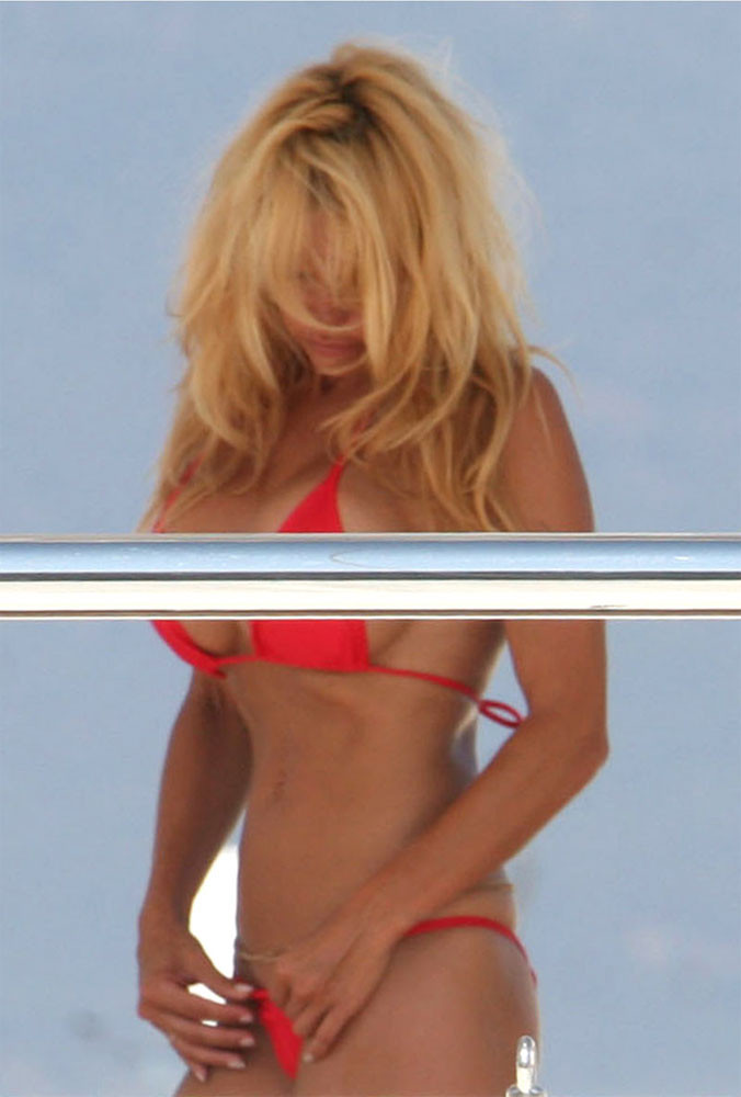 Pamela Anderson posing sexy in small red bikini paparazzi pics #75438384