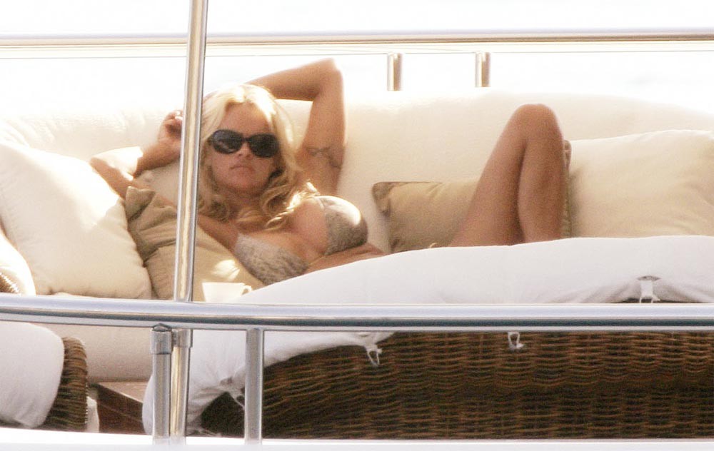 Pamela Anderson posing sexy in small red bikini paparazzi pics #75438464