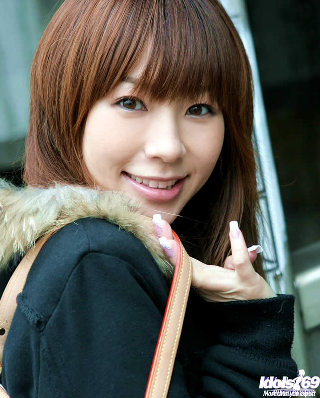 Adorable jap girl taking her clothes off