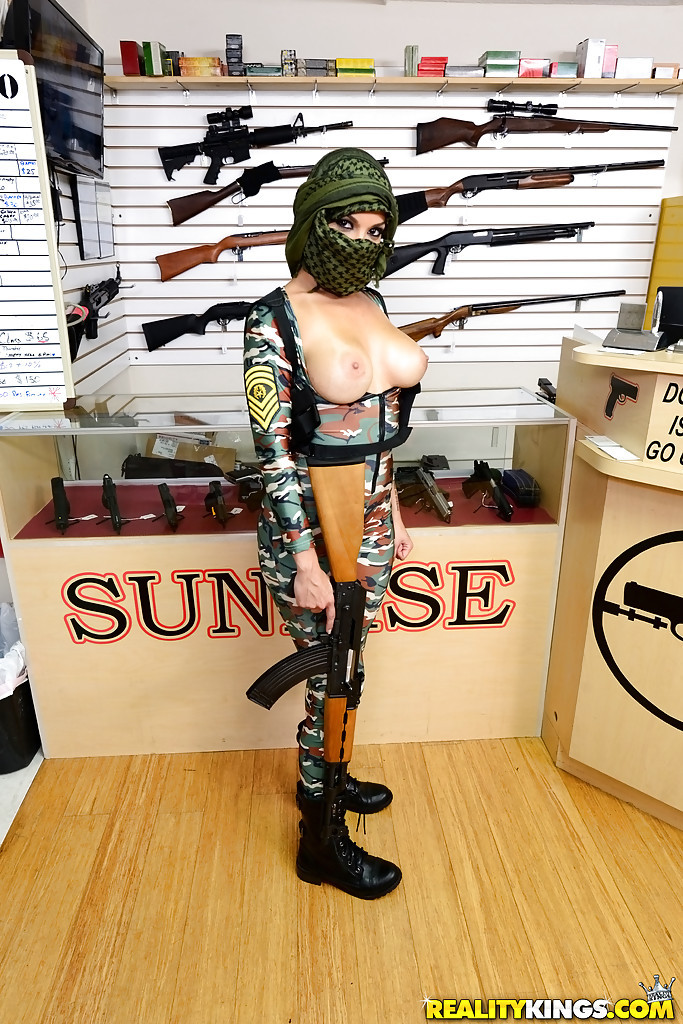Camouflaged araqb chick with rifle in hand lets her big natural  #69725662
