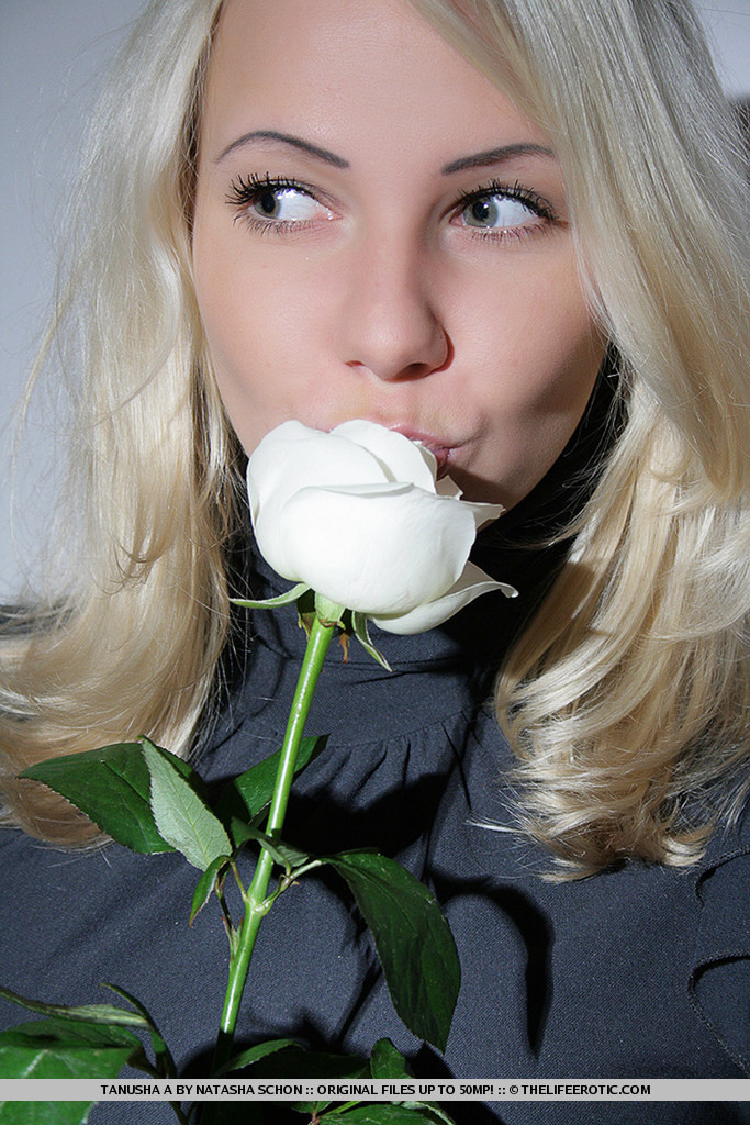 hot blonde coed posing with flowers #73528115