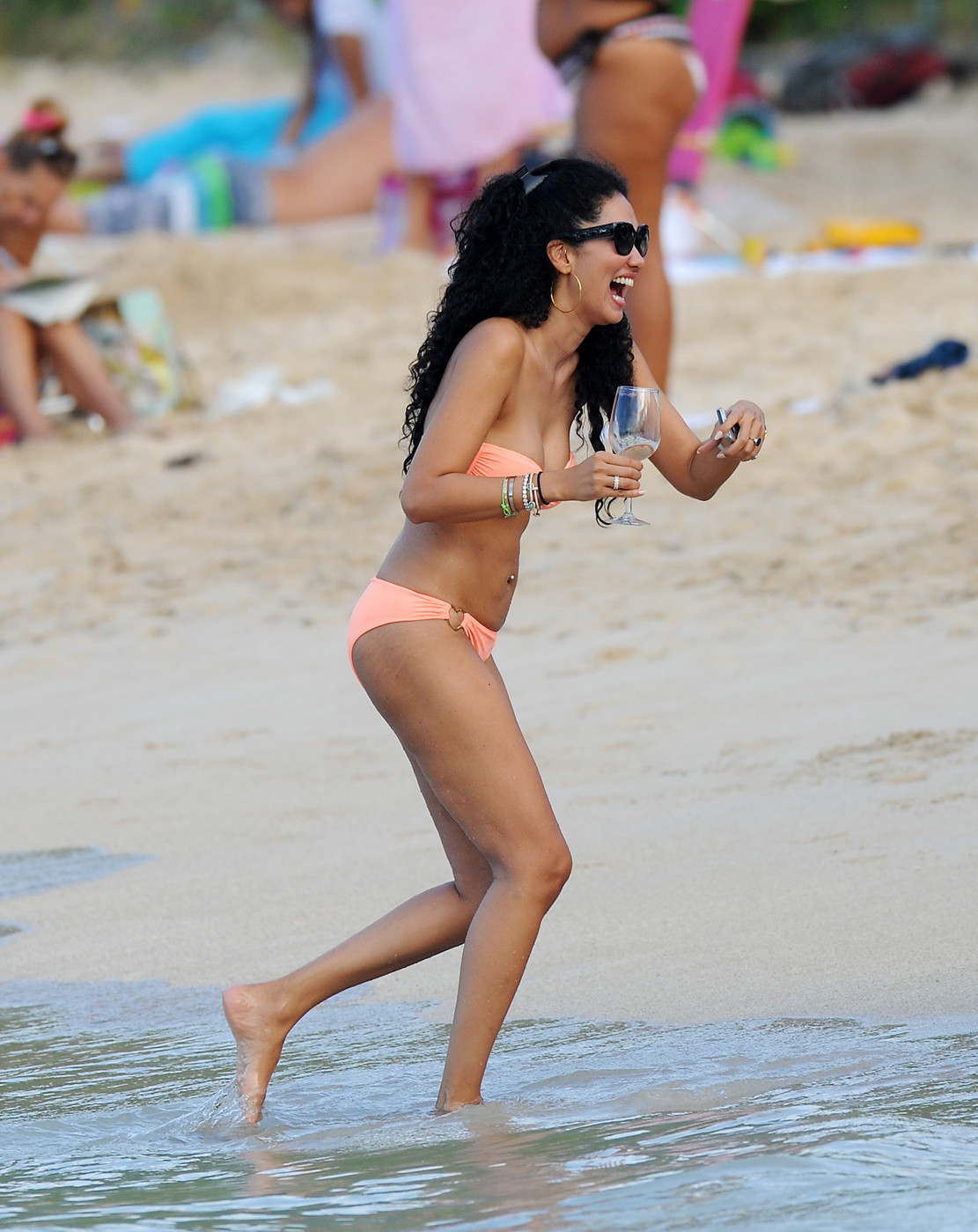 Kimora Lee Simmons wearing a strapless bikini on a beach in St. Barts #75209136