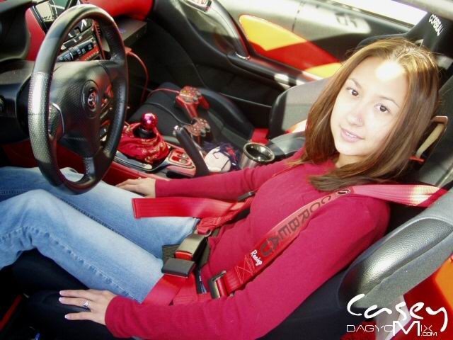 Asian teen posing outside with cars #70012391