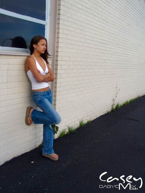 Asian teen posing outside with cars #70012404