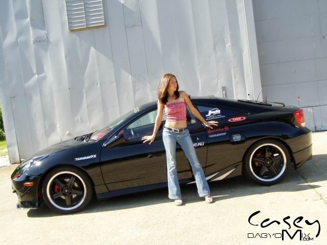 Asian teen posing outside with cars #70012425