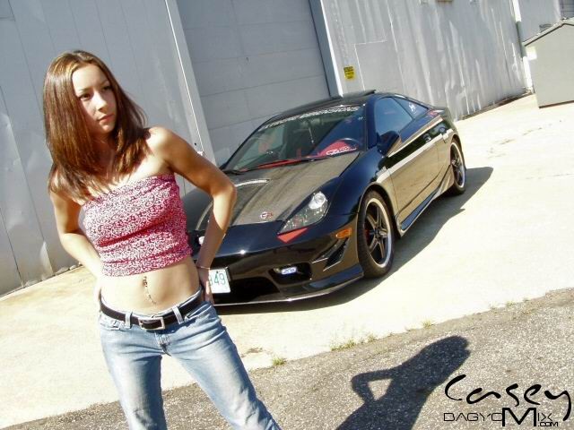 Asian teen posing outside with cars #70012438