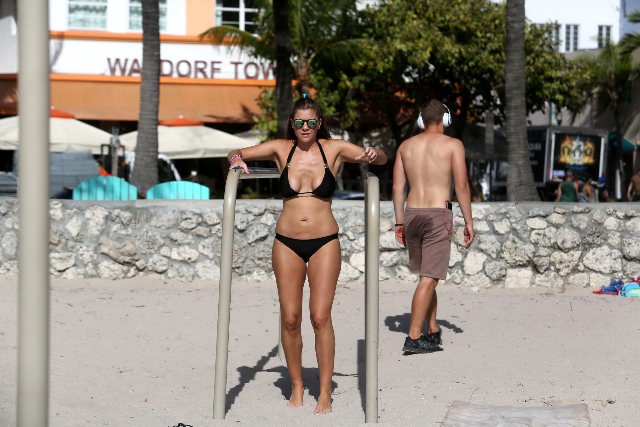 Busty Imogen Thomas works out wearing a skimpy black bikini on a beach in Miami #75170911