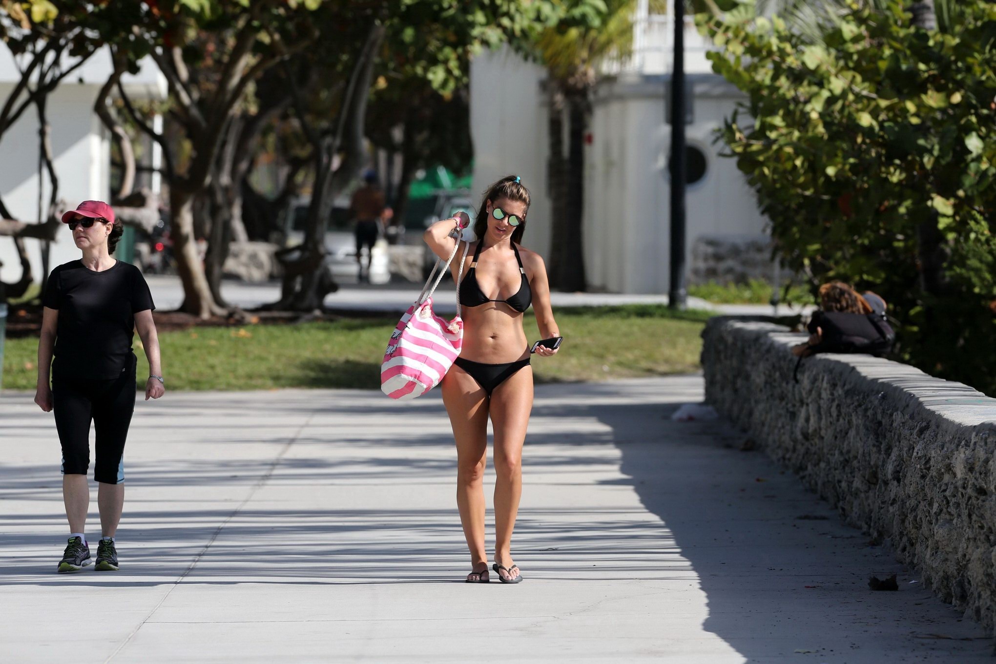 Busty Imogen Thomas works out wearing a skimpy black bikini on a beach in Miami #75170920