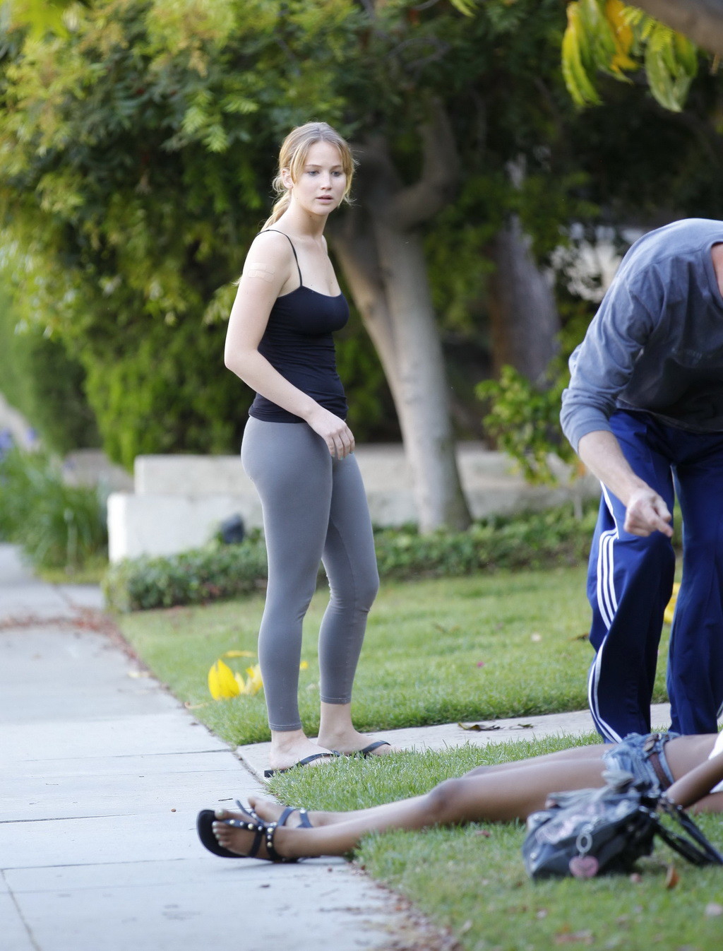 Jennifer Lawrence busty  booty in tights  top in Santa Monica helping a woman wh #75259231