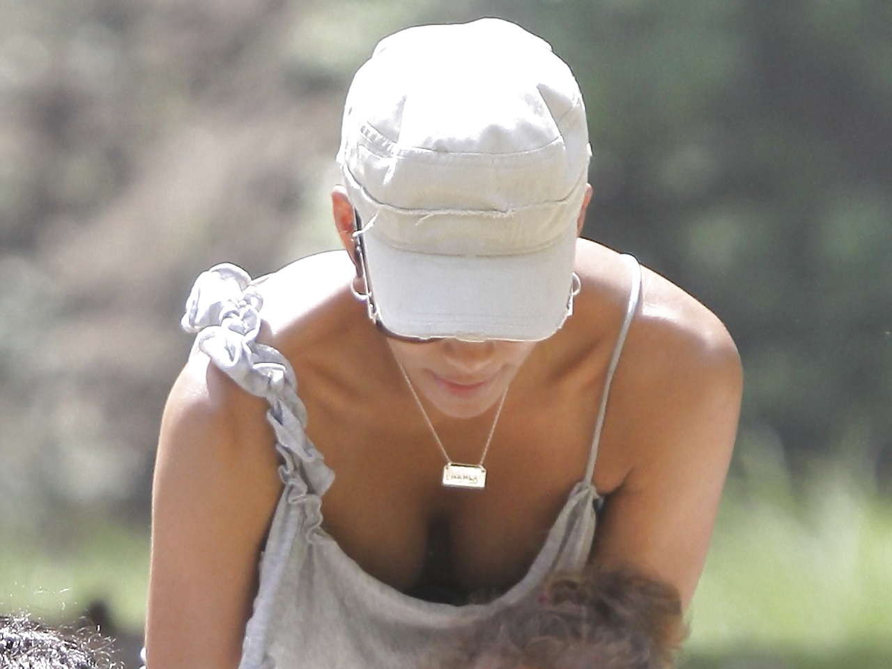 Halle Berry downblouse and showing her pussy and nice tits paparazzi pictures