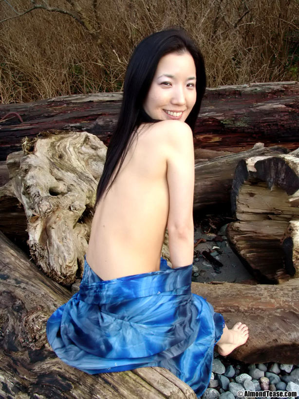 Asian shows off her shaved pussy at the nude beach #70025849