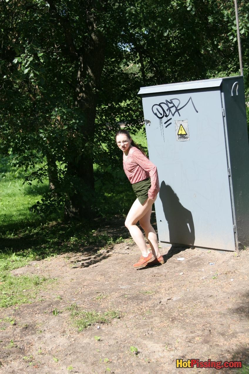 Cutie in glasses breaks her park walk and does a wee-wee cautiously #76523809