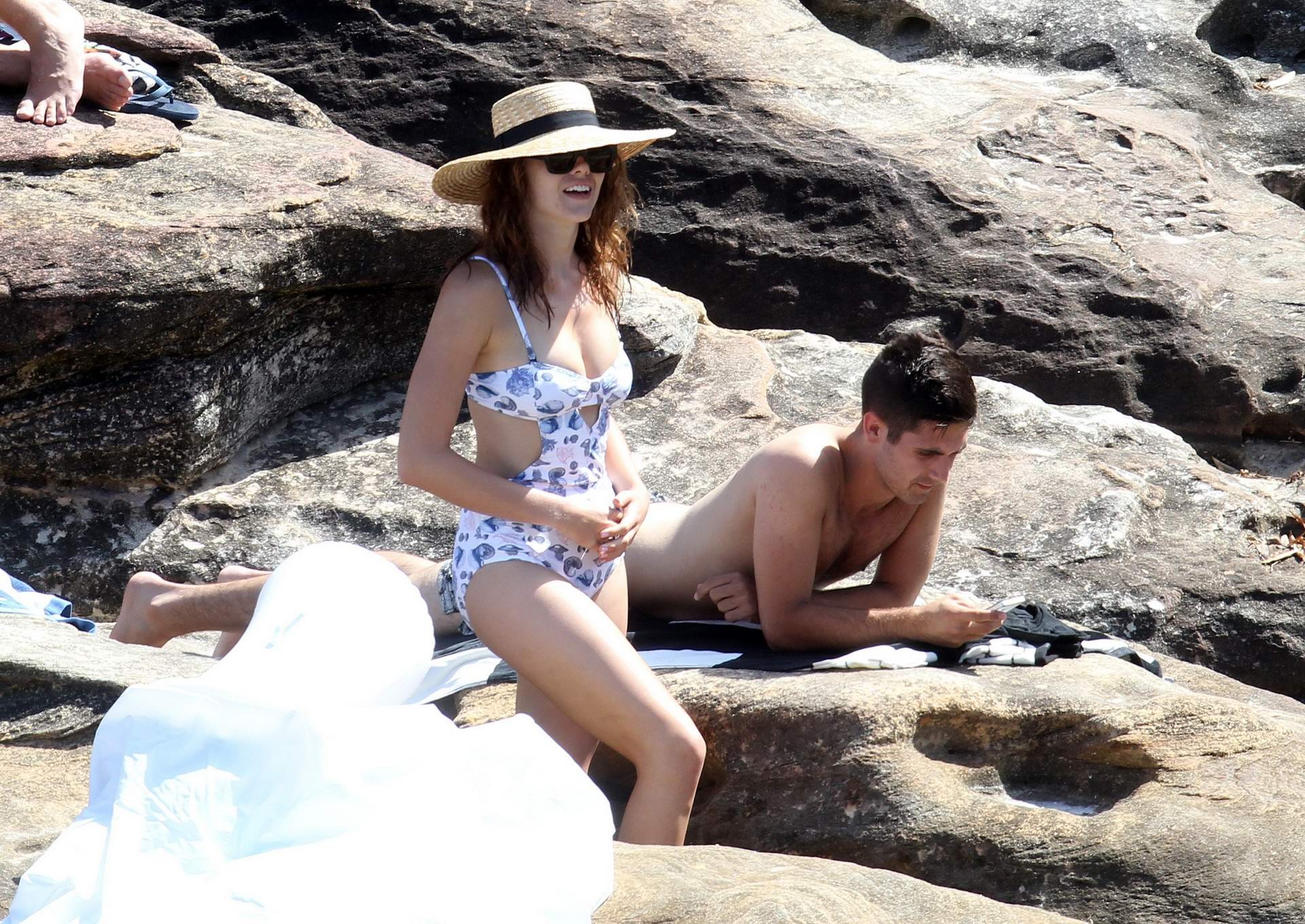 Demi Harman busty wearing a swimsuit on a rocky beach in Sydney #75177746