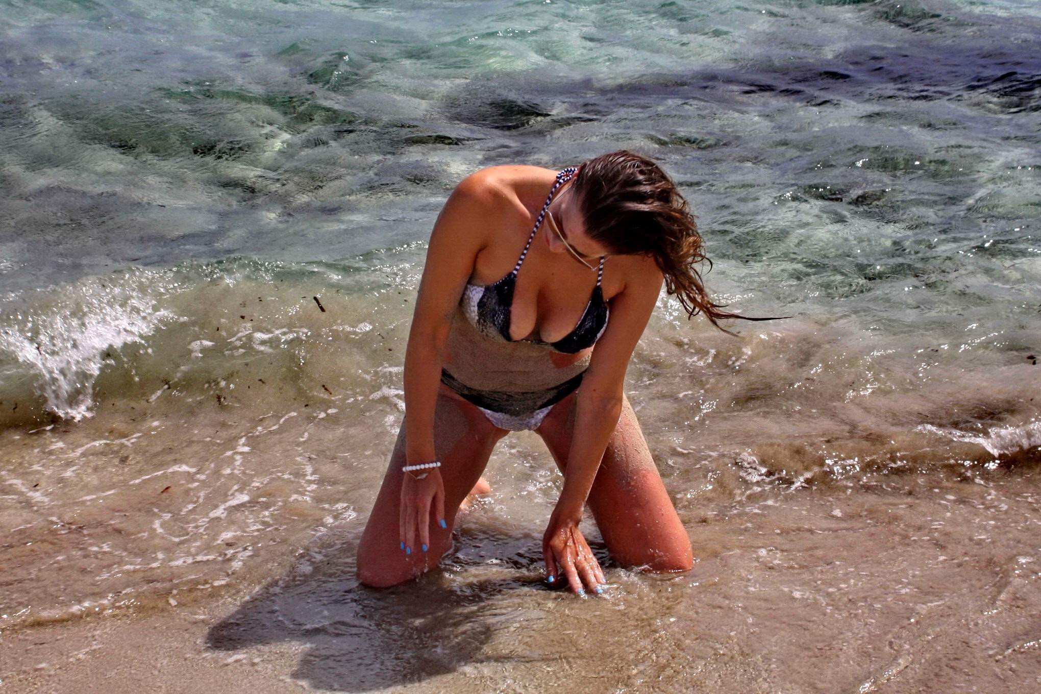 Imogen Thomas shows off her curvy body wearing a skimpy monochrome bikini on a b #75194460