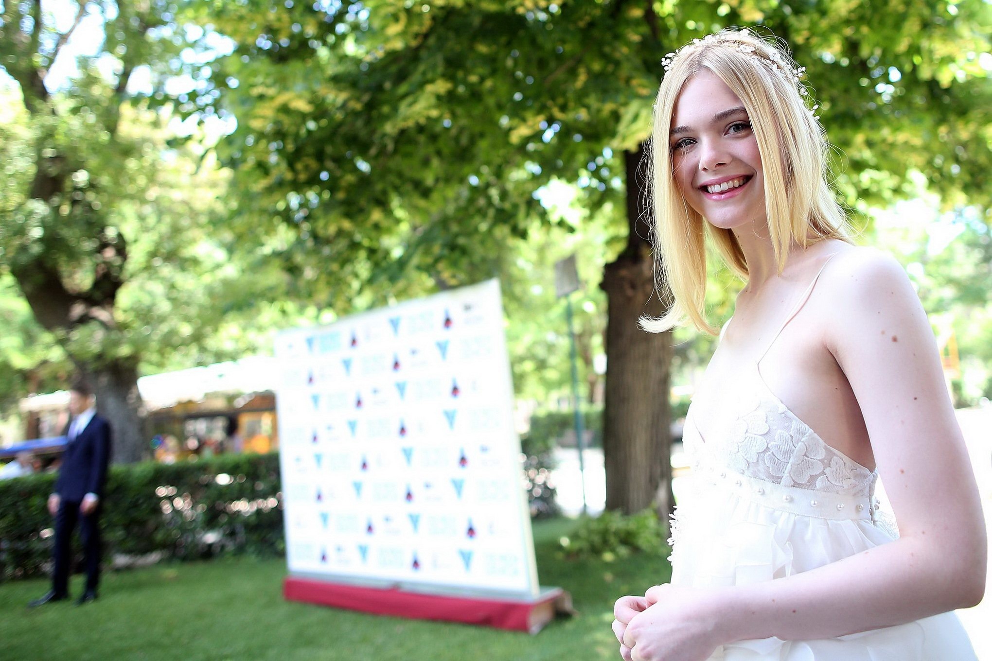Elle Fanning cleavy and leggy in white lace dress #75141726