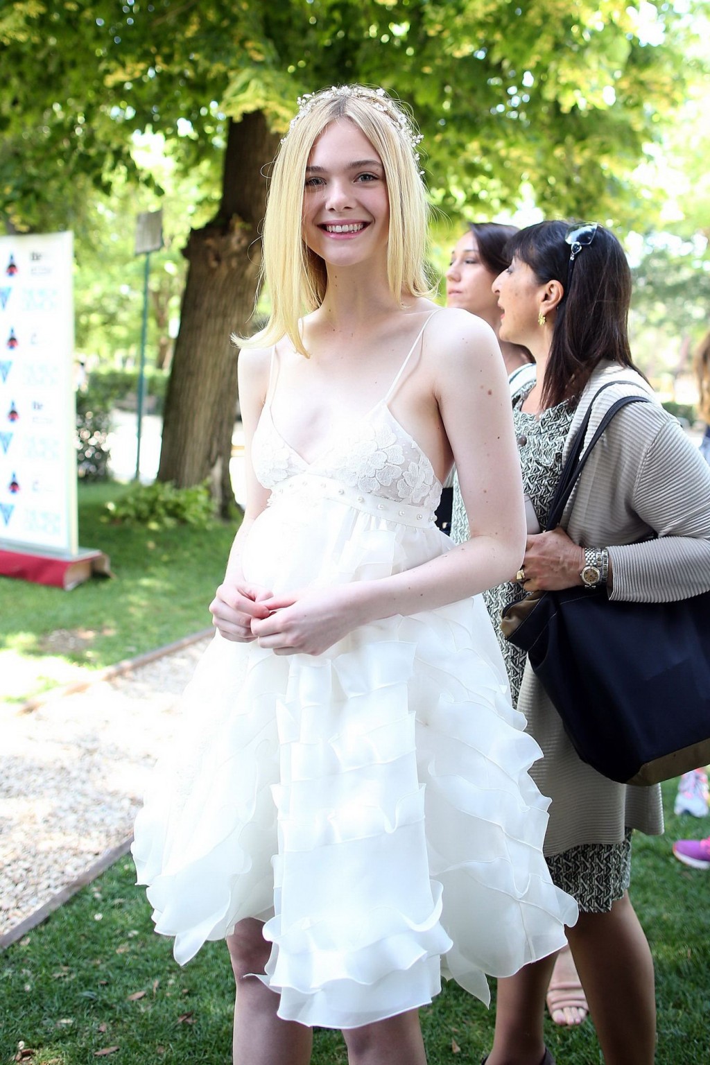 Elle Fanning cleavy and leggy in white lace dress #75141730