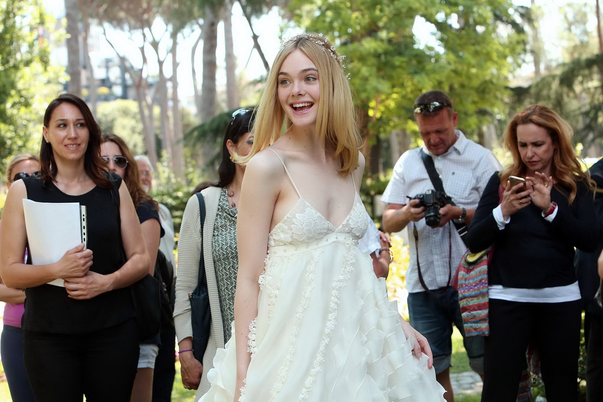 Elle Fanning cleavy and leggy in white lace dress #75141736