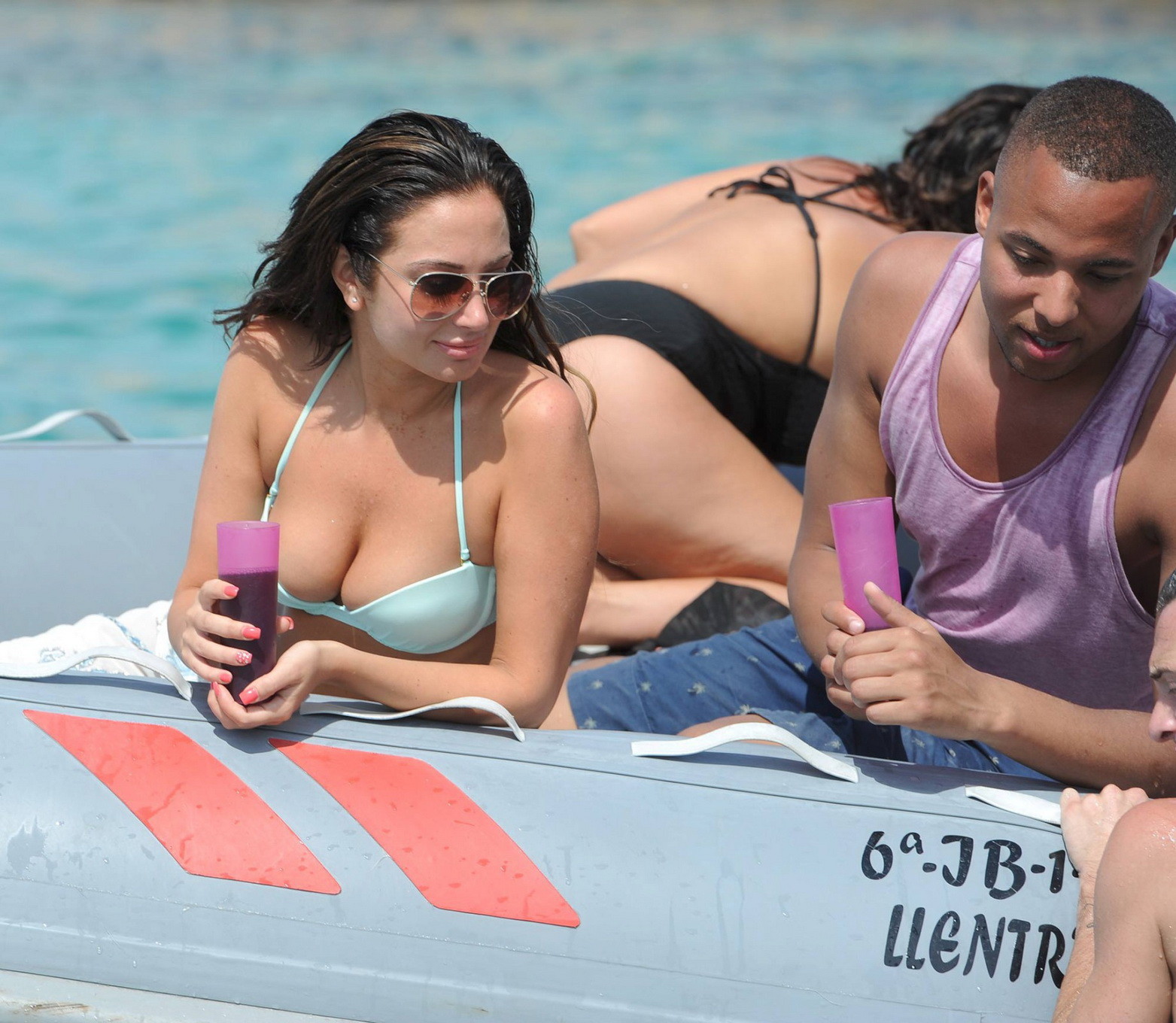 Tulisa Contostavlos busting out of her tiny blue bikini at the beach in Ibiza #75224357