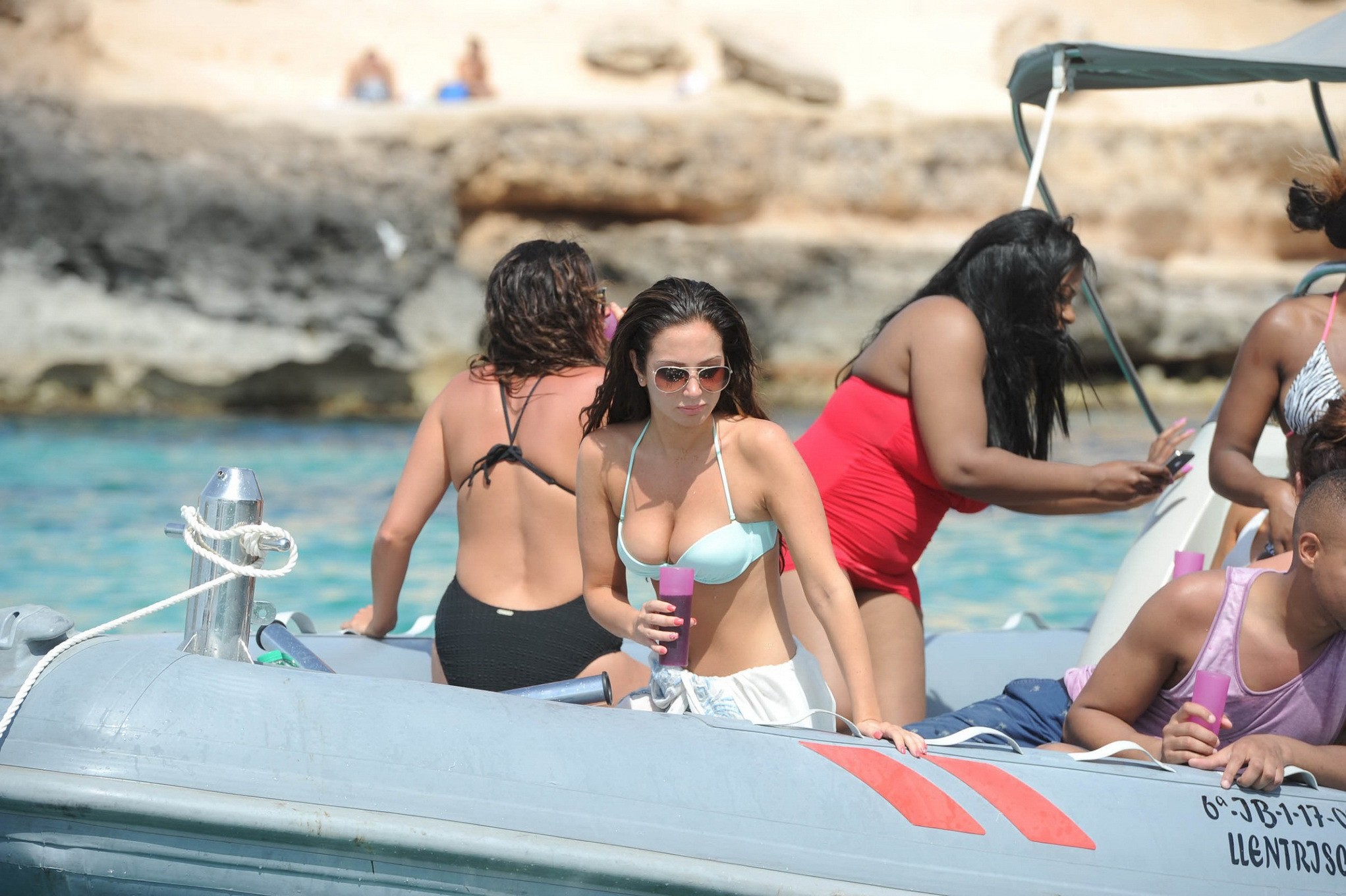 Tulisa Contostavlos busting out of her tiny blue bikini at the beach in Ibiza #75224377