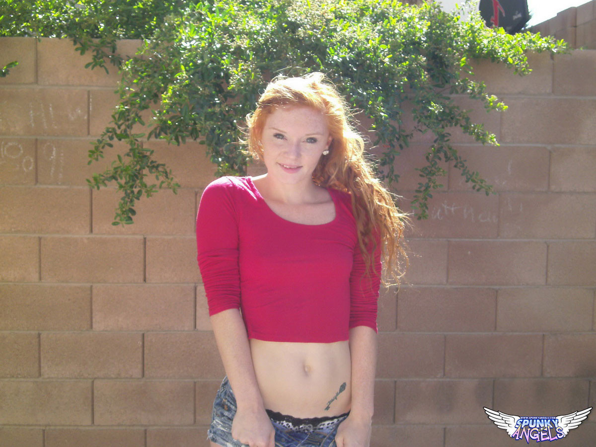 Cute redhead teen Alex Tanner shows off her perfect perky tits outdoors