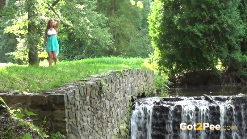 Girl lifts her dress and pees into a river #67459396