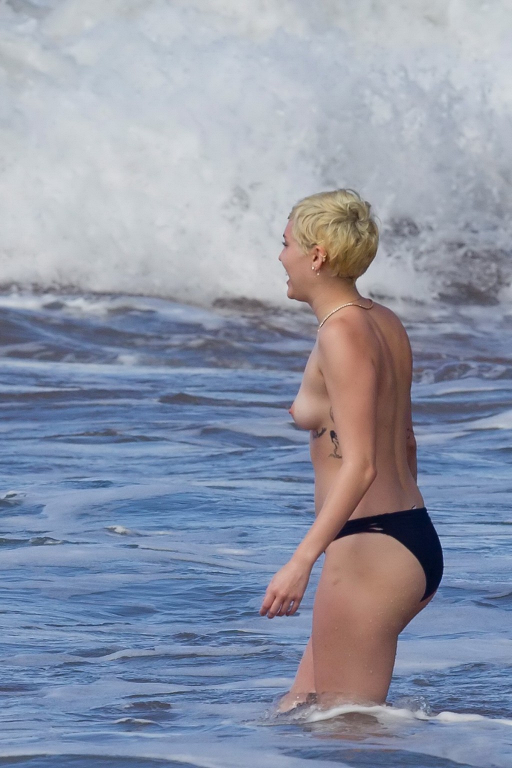 Miley Cyrus caught topless at the beach during the vacation in Hawaii #75174485