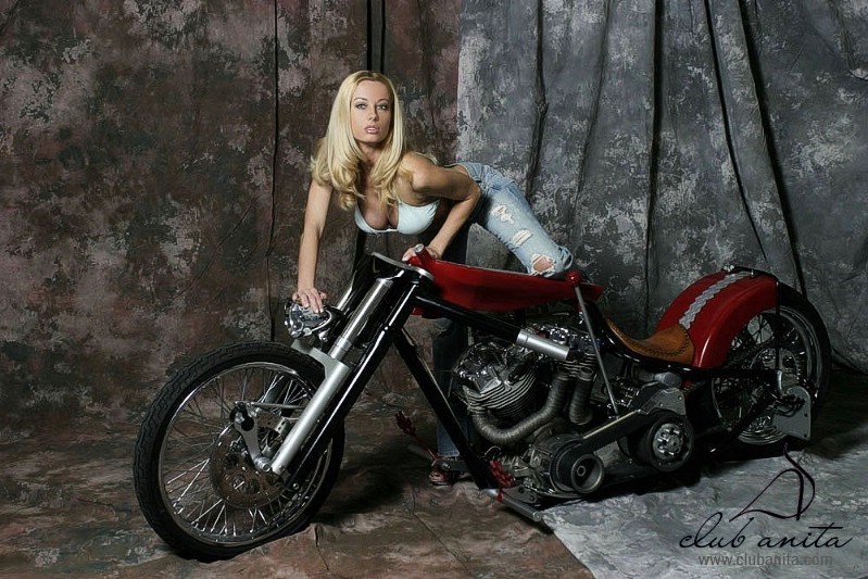 A blonde babe posing on a fat chopper #72738047