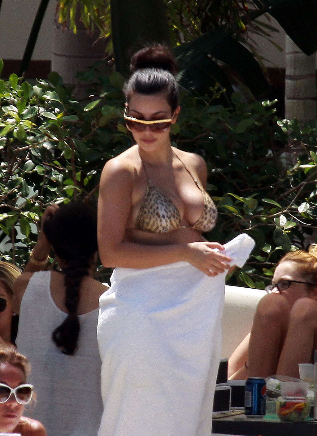 Kim Kardashian in leopard print bikini on pool paparazzi pictures and exposing h #75345104