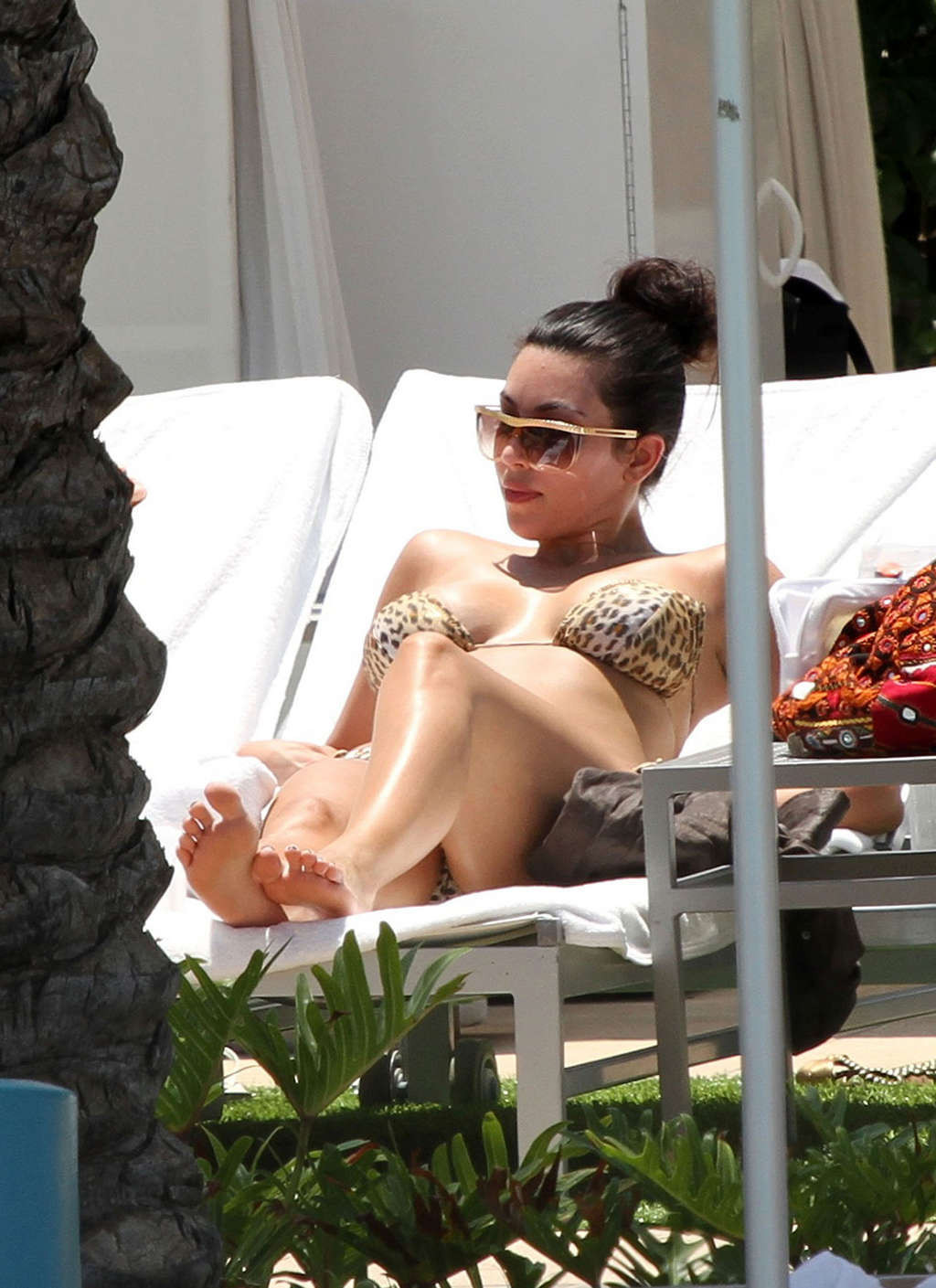 Kim Kardashian in leopard print bikini on pool paparazzi pictures and exposing h #75345113