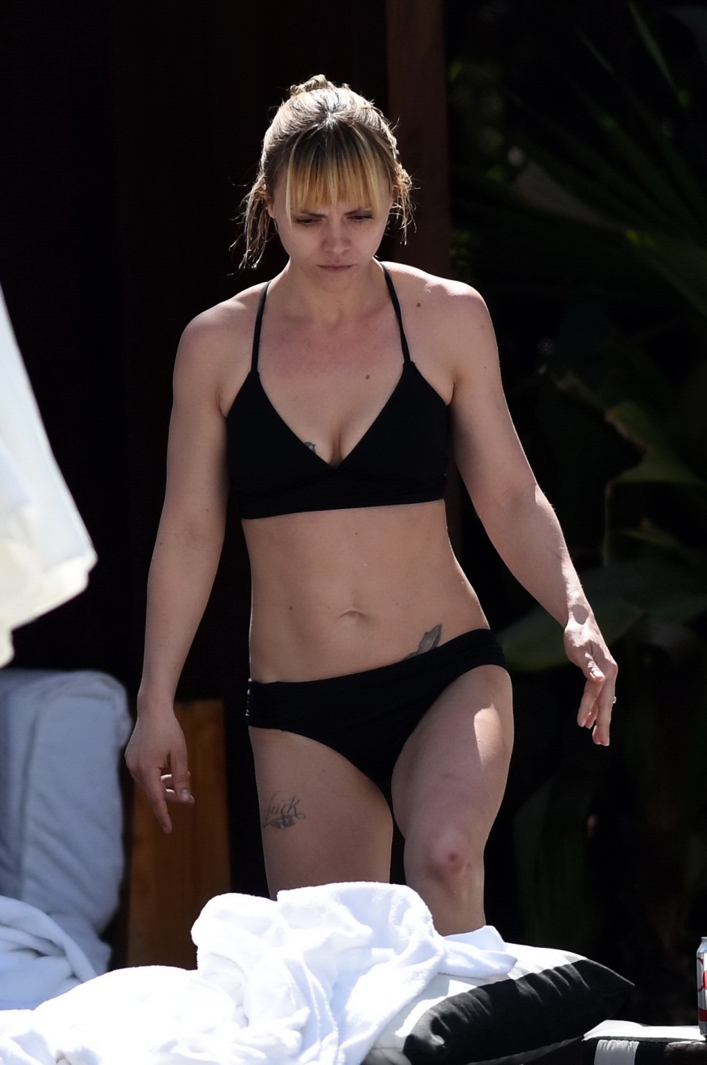 Christina Ricci shows off her hot bikini body poolside