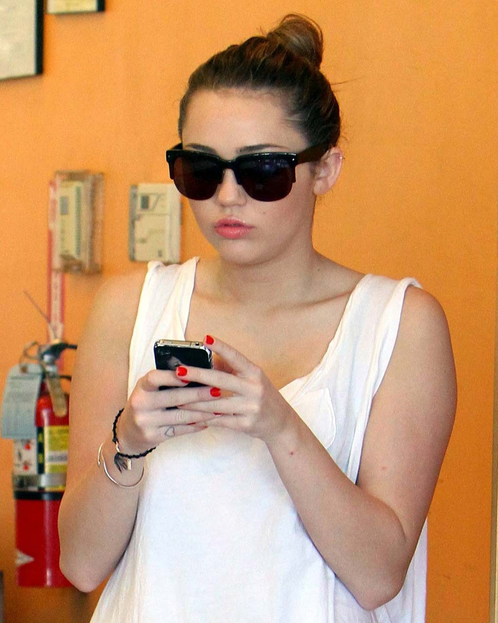 Miley Cyrus flashing her see thru bra in some sexy paparazzi pictures