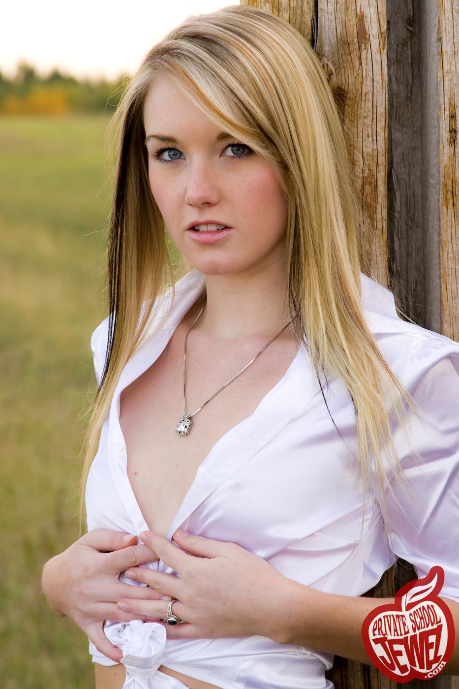 Cute blonde teen girl outdoors at farm #73530782