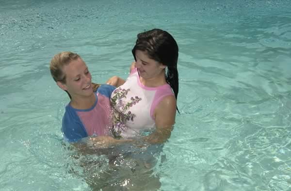 Two teens having fun in the pool #74100087