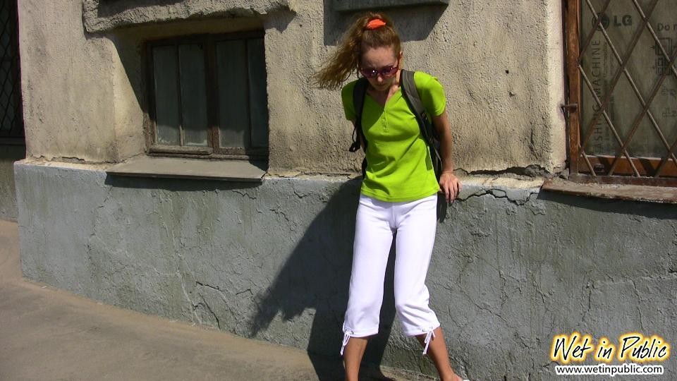 Humiliated slut who just pissed her white breeches right in the street #78594938