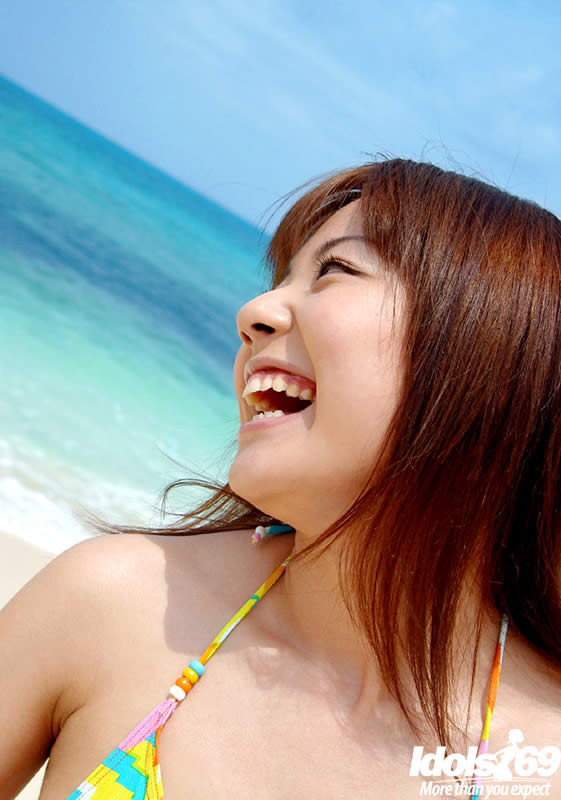 Beautiful japanese girl posing on a beach #69967003