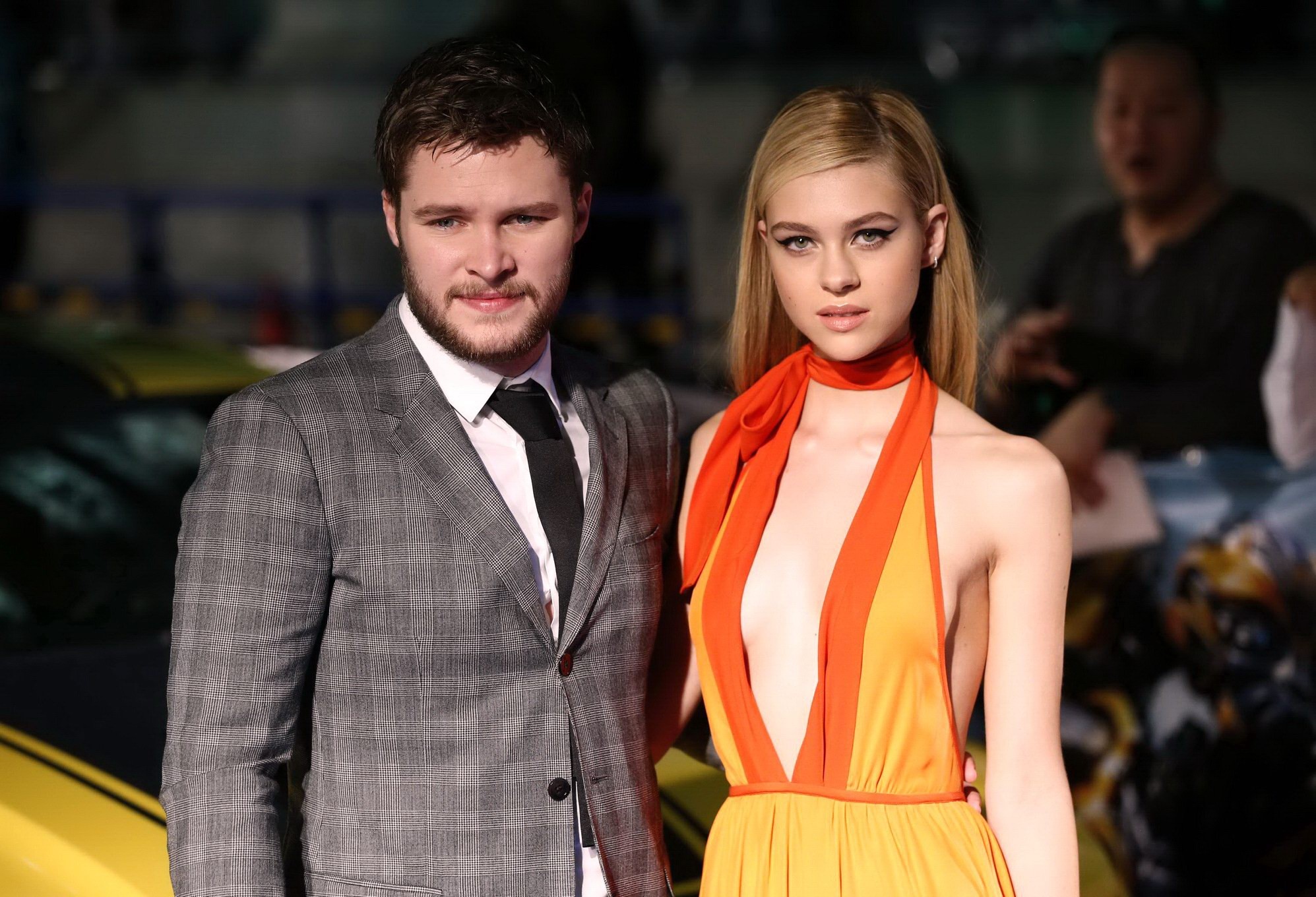 Nicola Peltz zeigt ihre Brüste braless in einem tief ausgeschnittenen orangefarbenen Bareback-Kleid bei einer
 #75189716