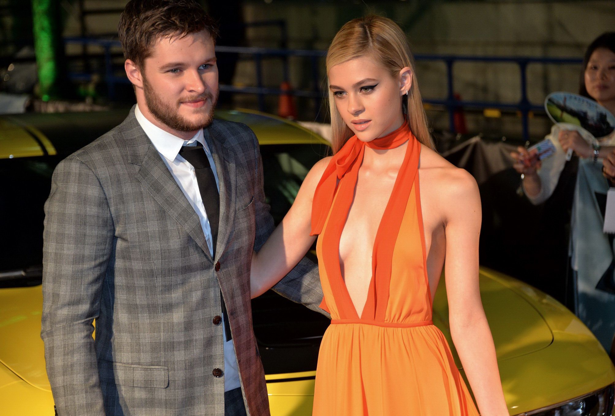 Nicola Peltz shows off her boobs braless in a low cut orange bareback dress at a #75189717