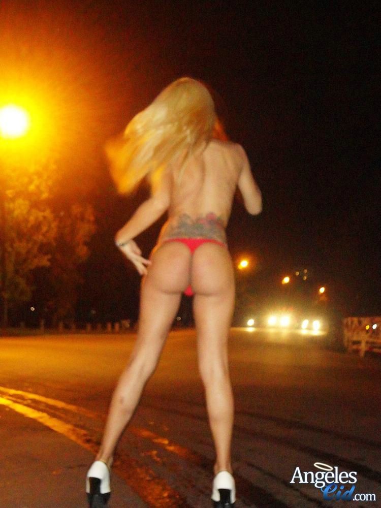 Angeles Cid puts on a nudie show in middle of street #78014205