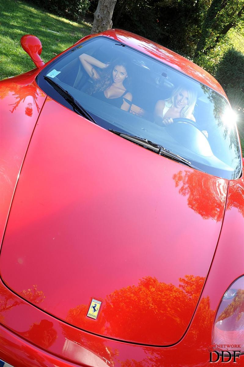 Danielle Maye and Krystal Webb screw in a Ferrari #78087681