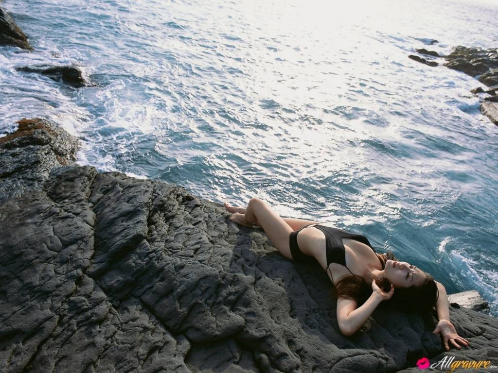 Japanese brunette model wet in bikini on the beach #73158204