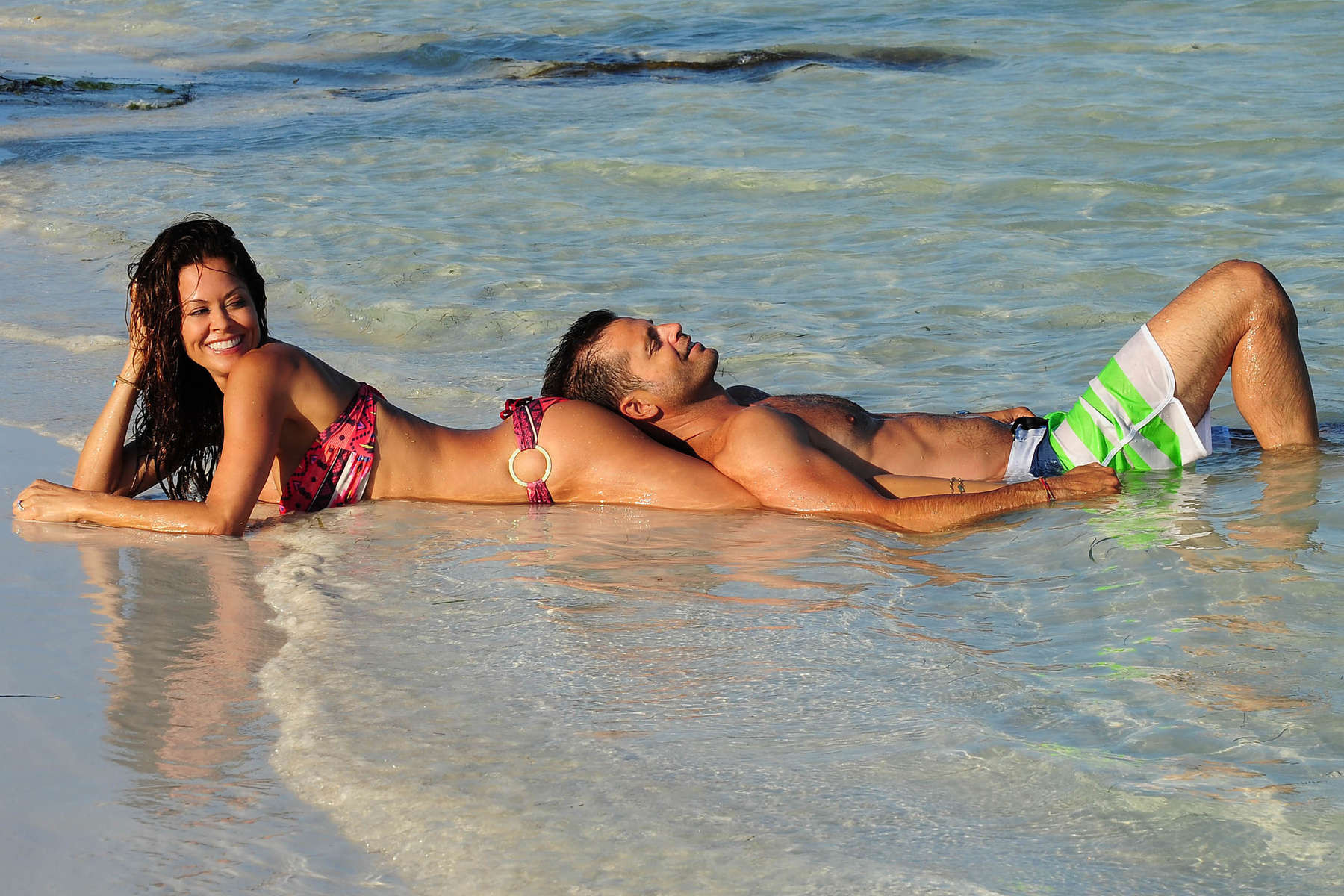 Brooke Burke doing a bikini photoshoot on a beach in Mexico #75228510