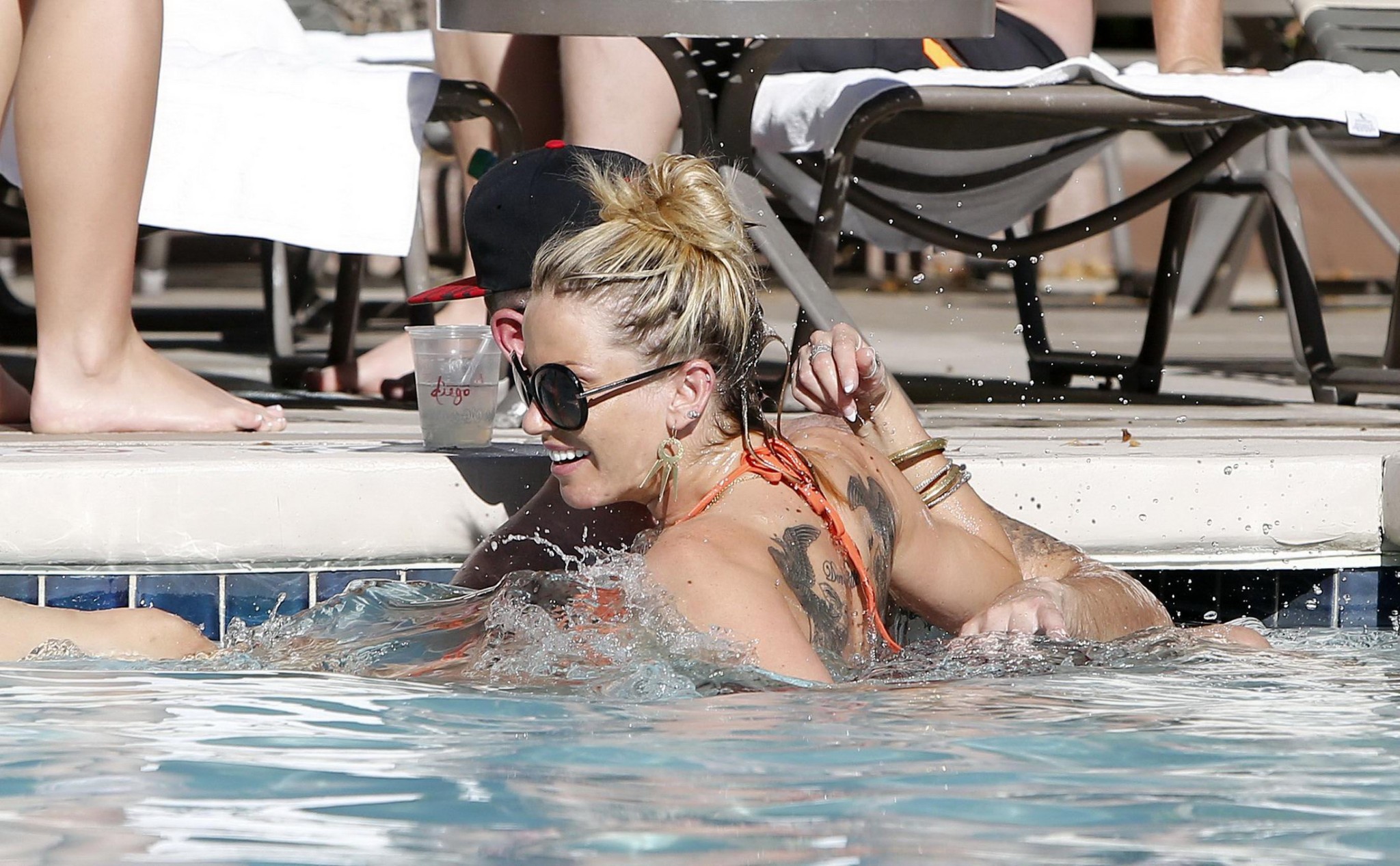 Sarah Harding wearing an orange bikini at the pool in Las Vegas #75208801