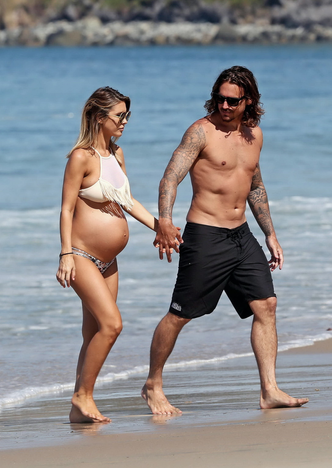 Audrina Patridge showing huge belly and boobs in a bikini